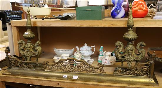 A pair of Victorian cast brass fire dogs and a cast brass kerb (2)